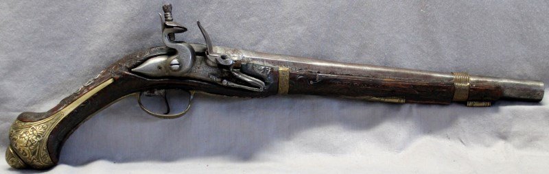ANTIQUE PERSIAN FLINTLOCK c. 1780 - GERMAN MUSEUM: Antique Persian Flintlock Pistol c. 1780. Extensive scroll carving, silver inlay, ornate brass butt cap. Purchased by our client at Richard Malone Quality Antique Firearms Ashville NC. PROVENANCE: A C