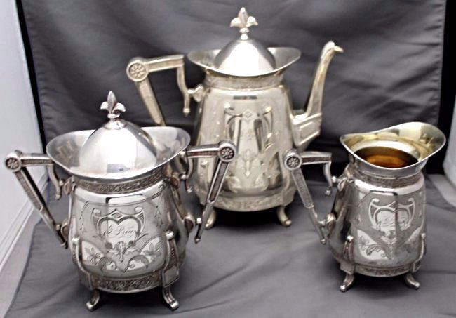 ANTIQUE 1876 AESTHETIC RACINE SILVER TEA SET: Very Rare Antique 1876 American Aesthetic Racine Silver Company Tea Set. Triple plated, includes Teapot, large creamer and large covered sugar. All monogrammed G. Price. The Racine Silver Plate Compan