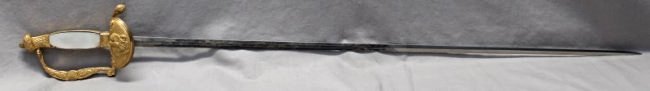 ORNATE MOP GILDED CEREMONIAL SWORD: We are very pleased to present this handsome 20th century, ca. 1950s, heavily gilded and ornate ceremonial parade sword, with the hilt guard finished in the style of the 1889 Prussian Infantry Degan s