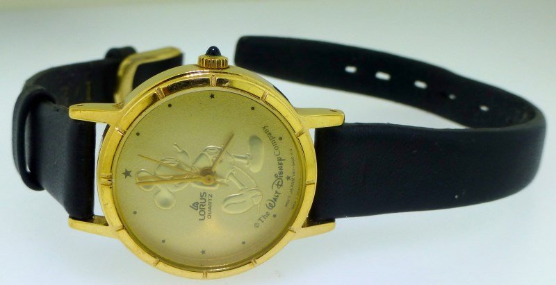MICKEY MOUSE WATCH GOLD FACE: Lorus Gold Faced Disney Mickey Mouse Watch with leather band. Watch is working. PROVENANCE: A Charleston SC Private Estate