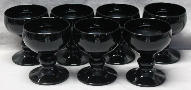 7 1930s BLACK AMETHYST WINE / COCKTAIL GLASSES: 7 early 1930s Black Amethyst Wine / Cocktail Glasses. These are a rich deep purple when held to light. Good condition, these are early Black Amethyst. Provenance: A Charleston South Carolina Private E