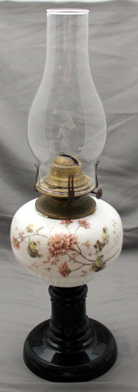 QUEEN ANNE OIL LAMP c. 1890s: Queen Anne Oil Lamp c. 1890s. Opal Glass Font with Nuns on a Black bony Glass Foot. There is a Patent Date of Oct 28, 1890 on all 3 parts. Scoville burner. PROVENANCE: A Charleston South Carolina Priv