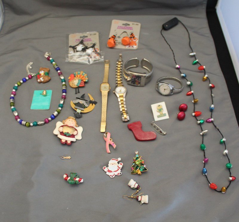 ESTATE LOT HOLIDAY JEWELRY AND WATCHES: Lot of Estate Holiday Costume Jewelry and Watches. Holloween Chrismas, Thanksgiving. Watches include Christmas watch bangle, ladies Seiko, ladies Timex, ladies Ann Klein. All watches untested. 13 oz.