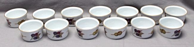 13 EVESHAM GOLD ROYAL WORCESTER RAMEKINS: 13 Royal Worcester Porcelain Evesham Ramekins. Each measures 3 1/4x3 1/4x1 5/8. Evesham Gold is a classic porcelain pattern developed in 1961, depicting the autumnal fruits of the Vale of Evesham with