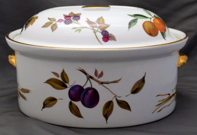 EVESHAM GOLD ROYAL WORCESTER LARGE COVERED CASSEROLE: Large Evesham Gold Royal Worcester Covered Casserole. Measures 12x9 1/4x8. Evesham Gold is a classic porcelain pattern developed in 1961, depicting the autumnal fruits of the Vale of Evesham with the 