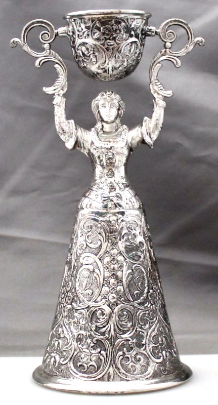 SILVERPLATED WEDDING WAGER CUP: Vintage Rogers Silver Plated Marriage Wedding Toasting Wager Cup 8 1/4" Tall. Figure of a maiden with embossed bell featuring cherubic faces and foliate scroll. Articulated upper cup. Gold plated bow