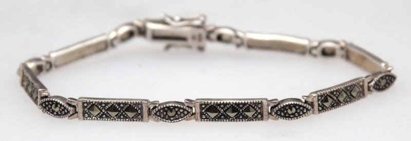 ESTATE STERLING ART DECO MARCASITE BRACELET: Estate sterling silver Art Deco Marcasite Bracelet. The bracelet is marked 925, is in a Art Deco pattern and has a double safety latch. In very good condition. Marcasite started to gain use and popula
