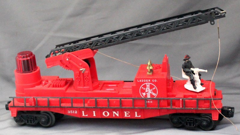 LIONEL TRAINS FIRE LADDER COMPANY FLAT CAR No. 3512: Operating Fireman and Ladder Car No. 3512. This Car was produced from 1959 until 1961 on a red body mold 6424-11 Die 4 with white heat-stamped lettering and AAR trucks equipped with disc coupler