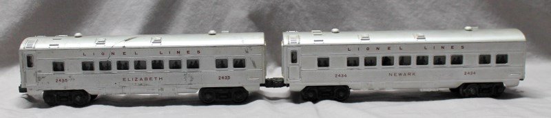 2 LIONEL TRAINS PULLMAN CAR No. 2435 +2434: The Lionel Elizabeth Pullman Car No. 2435 and the Lionel Newark Pullman Car No. 2434 were cataloged from 1954 until 1958 and were available for separate sale in 1959. This car is lighted by two lamps