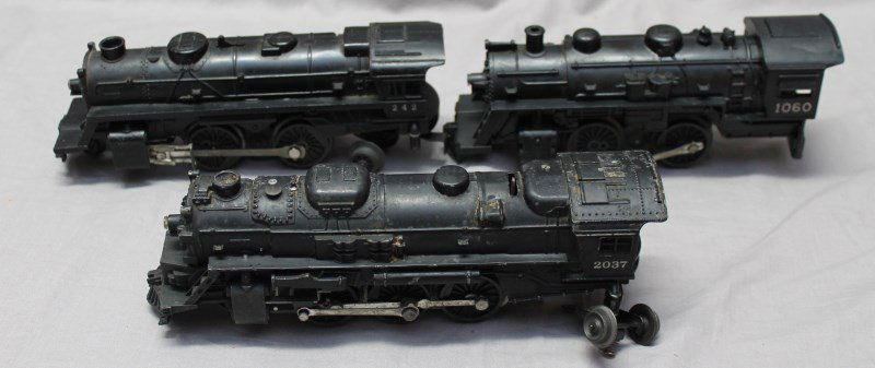 3 1950s LIONEL LOCOMOTIVES 242-1060-2037: 3 Lionel Locomotive, a Lionel Trains 242 Scout Locomotive, a 1060 Scout Locomotive, wheel broken, bar loose, wheels missing, a Lionel Adriatic Type 2-6-4-Locomotive No. 2037, missing wheels. 1. The Li