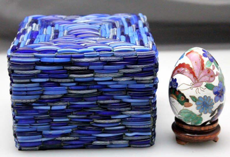 2 pc CLOISONNE EGG & BEADED BOX: Vintage Cloisonne Egg on rosewood stand. Measures 3.35 tall on stand. Also a multi shades of blue bead box. Lined with black felt, perfect for a side table or desk top. Box measures 4.25x4.25x3.50. PR