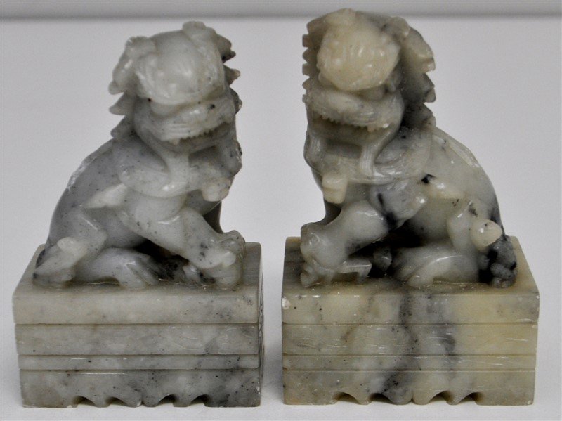 CHINESE CARVED SOAPSTONE SHISHI / FOO LIONS: A matched pair of older Chinese Carved Soapstone Shishi / Foo Lions / Dogs. The female with cub and male with a ball. Each measures approximately 2.50x1.75x3.50. Wt. 1 pd 4 oz combined.. Chinese guard