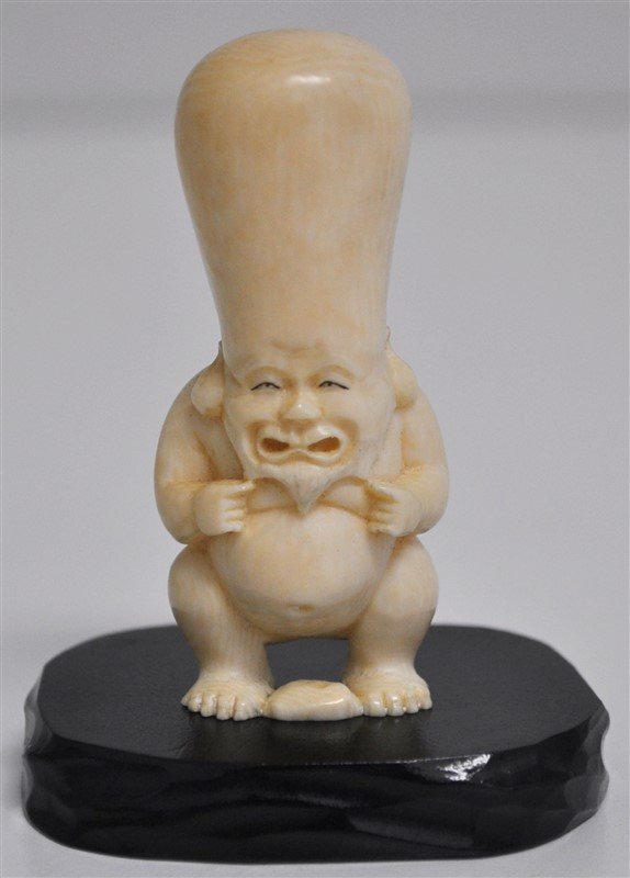 JAPANESE NUDE MEIJI PERIOD IVORY SHUNGA NETSUKE: Japanese Antique Carved Polychrome Ivory Shunga, Meiji Period: very detailed and finely carved. A nude elder with large forehead. With small wood stand. Acquired before the 1970 ivory ban. This item w
