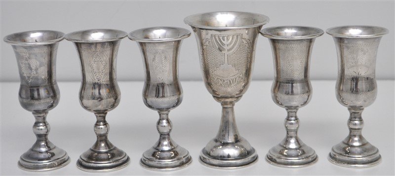 6 STERLING SILVER JUDAICA KIDDUSH CUPS: 6 Vintage Sterling Silver Traditional Kiddush Cups. The tallest is etched with a Menorah and Hebrew. The others are all etched with the Magen David (Star of David). No monograms. The Shabbat and Jewis