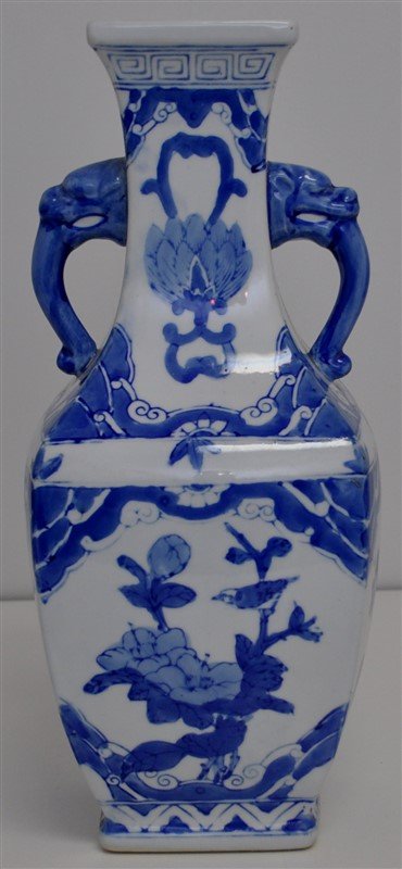 TALL CHINESE BLUE AND WHITE SQUARE VASE FOOS: Tall 20th c. Chinese Blue and White Vase, 14.25 tall. Foo Dog Handles. Hand Painted with Cranes, Mums, Birds and Lotus. Measures 6x6x14.25. Weight 5 pds. PROVENANCE: A Historic Charlotte Street Home, 