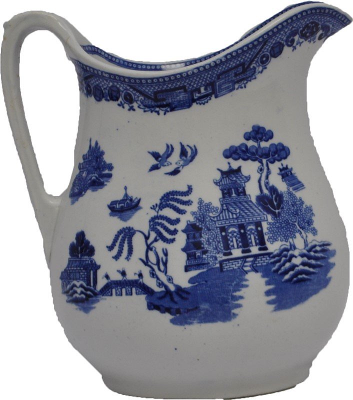 LARGE ANTIQUE STAFFORDSHIRE BLUE WILLOW PITCHER: A large Antique Staffordshire Blue Willow Water Pitcher / Cider Jug made in England for retail at L. Straus & Sons New York late 19th, early 20th century. Measures 8.25x5.75x9. The Straus family origi