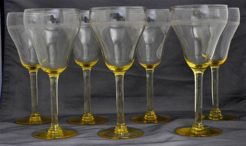 7 ELEGANT ETCHED CRYSTAL YELLOW STEM WINE GLASSES: 7 Vintage Elegant Etched Crystal Yellow Stem Wine Glasses. Each measures 3x3x7". Good Condition. Wt in Box 2 pds 11 oz. PROVENANCE: The Estate of a Litchfield Connecticut Antique & Art Dealer.