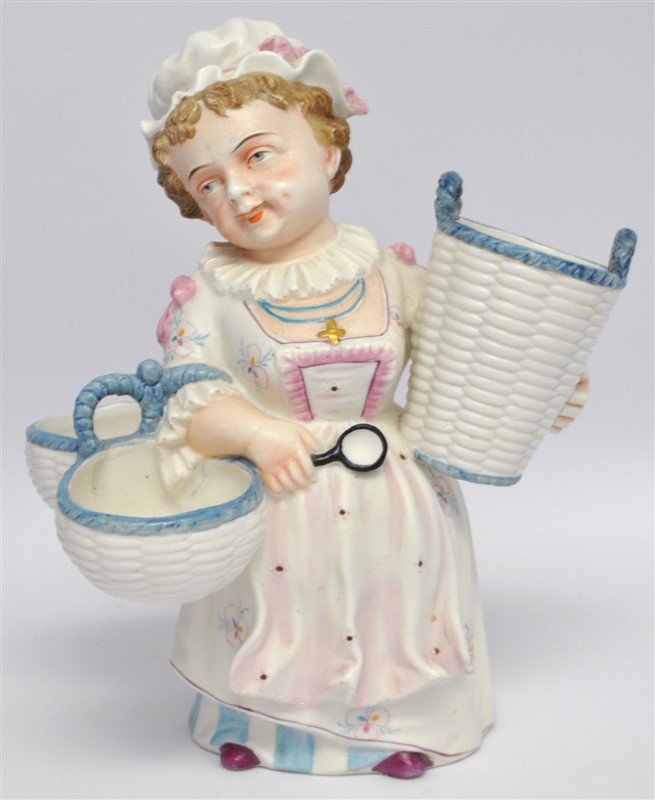 ANTIQUE BOHEMIAN PORCEAIN BISQUE FLOWER LADY: A ca. 1910-1920, very clever & well executed Bohemian hand painted bisque, combination little girl toothpick and mint holders figurine! The base carries a mold number (8 & 1288). There are also finish