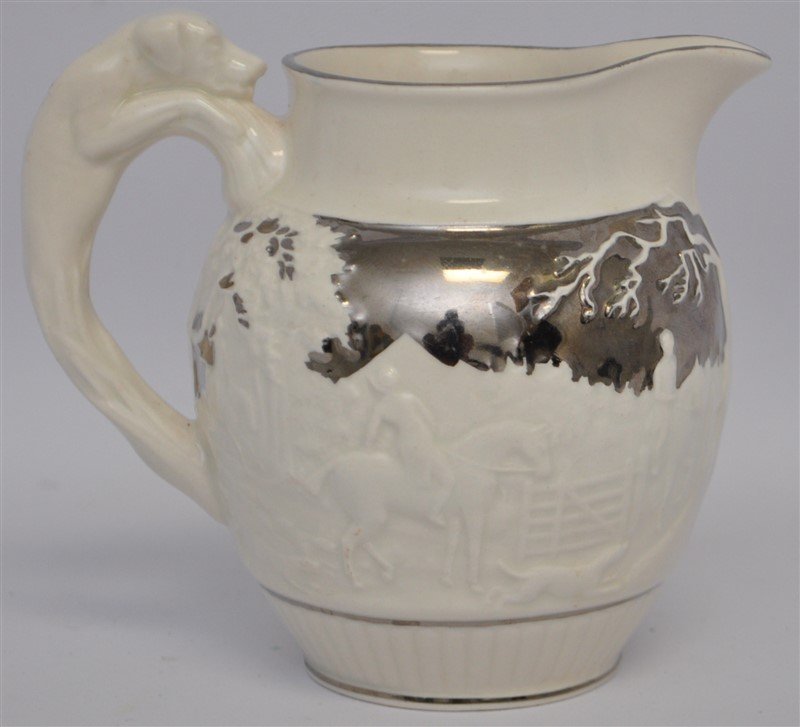 WEDGWOOD SIVER LUSTERWARE HUNT JUG: A Older Wedgwood Hunt and Hound Jug with figural Dog Handle and Silver Lusterware accents. The bottom marked with Wedgwood of Etruria & Barlaston, made in England. Measures 5"x3.50"x4.50", Wt. 11 oz. 