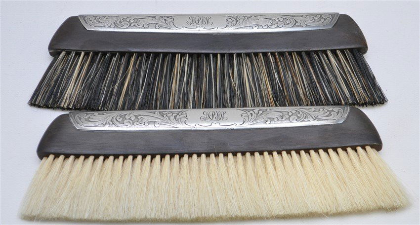 2 STERLING & EBONY CLOTHES BRUSH ORIG CASE: Cased Set of Two Ebony and Sterling Silver Clothes Brushes. The Wood is marked France Natural Ebony. The Top marked Sterling. Ornate scroll, with script monogram. Each Brush measures 7" long and 2 1/2