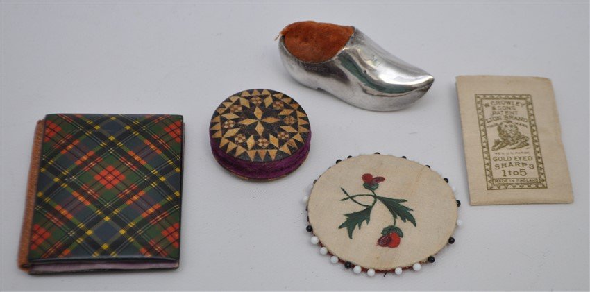 4 pc 19th c. TARTANWARE & STERLING SEWING ETUI: 1- 19th c McBeth Tartanware Mauchline Needle Case and a package of unused gold eye sharps needles from England . Case 2 1/2"x2". 2- A English Sterling Silver Figural Shoe Pin Cushion, 2.25" long. 3- A