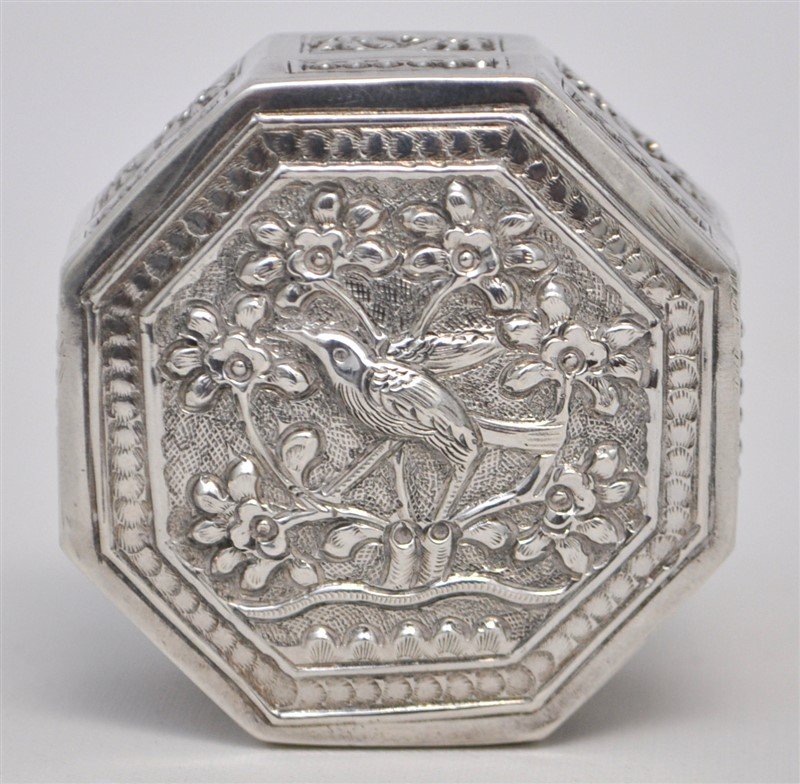 ORNATE STERLING SILVER BIRD SNUFF BOX: Ornate Sterling Silver Repousse Bird Snuff / Pill Box. Octogonal, with Bird and Florals. Measures 2"x2"x1". Weight 35 grams. PROVENANCE: A Private Charleston SC Estate.