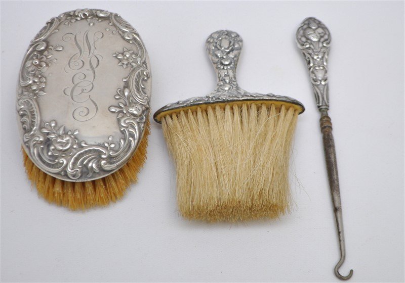 3 PC STERLING VANITY ITEMS ORNATE CHERUB BUTTON HOOK: Antique Sterling Silver Vanity Items. 1- Antique English Sterling Handle Button Hook, with Winged Cherub and ornate scroll handle. Hallmarks for Birmingham, Sterling and 1905 date mark. English Steel 