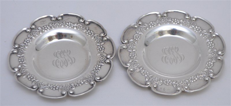 PAIR STERLING SILVER BLACK STARR FROST BUTTER PATS: A Matched Pair of Antique Sterling Butter Pats by Black, Starr and Frost. Floral Swag and Scroll. Each 3.65"x3.65". Monogrammed. Weight 50 grams. PROVENANCE: A Charleston, SC Private Estate.