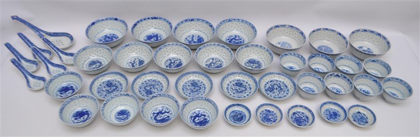 35 PC VINTAGE CHINESE EXPORT RICE GRAIN PORCELAIN: Group of 35 Pieces of Vintage Chinese export porcelain with the 'rice grain' pattern, blue and white with central motif of a dragon. 4 Soup Bowls 4.25x4.25. 13 Tea Bowls 2.75x2.75. 6Rice Bowls 4x4. 5 
