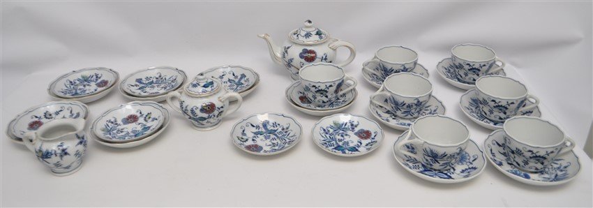 30 pc VINTAGE BLUE DANUBE INCL TEAPOT: 30 pc Vintage Blue Danube. 6 Blue & White Cups, 1 Blu, White & Color cup. Vintage Blue Danube with Color from Mascot China Teapot, cream and sugar. The balance are saucers. Lid to sugar with crack, th