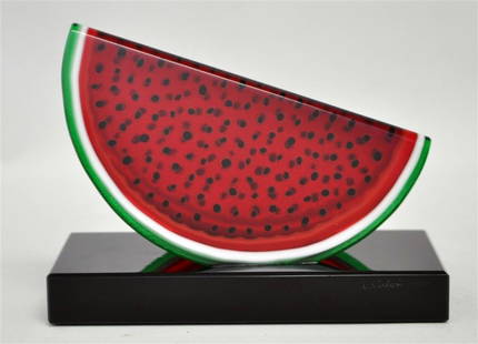 LUCIANO VISTOSI (1931-2010) WATERMELON: Contemporary Murano Glass Watermelon Sculpture by Designer Luciani Vistosi (1931-2010). Signed and dated 1993 by the artist. On black glass base measures 6x3x4.50". Weight is 1 pd 9 oz. PROVENANCE: