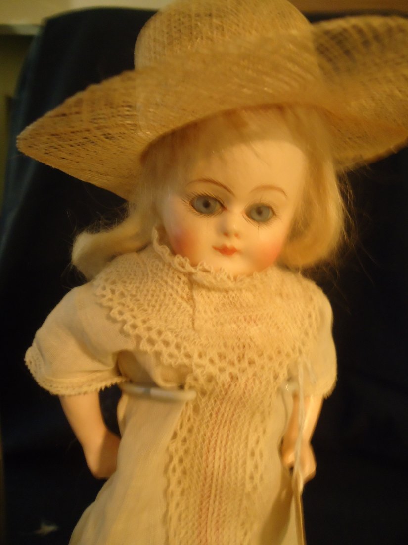 14" Early German Paper Mache Doll: Early German paper mache doll, blue paperweight eyes composition arms, muslin body,early shoes. Note that came with the doll- "Doll given to Mae Hanson Dec 25th 1893 by Mrs. Marshall. This is a charme