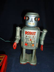 Robot- Battery Operated: Near mint lithography, 7 1/2" tall, needs a little work to the battery box, Modern Toy- Made in Japan.