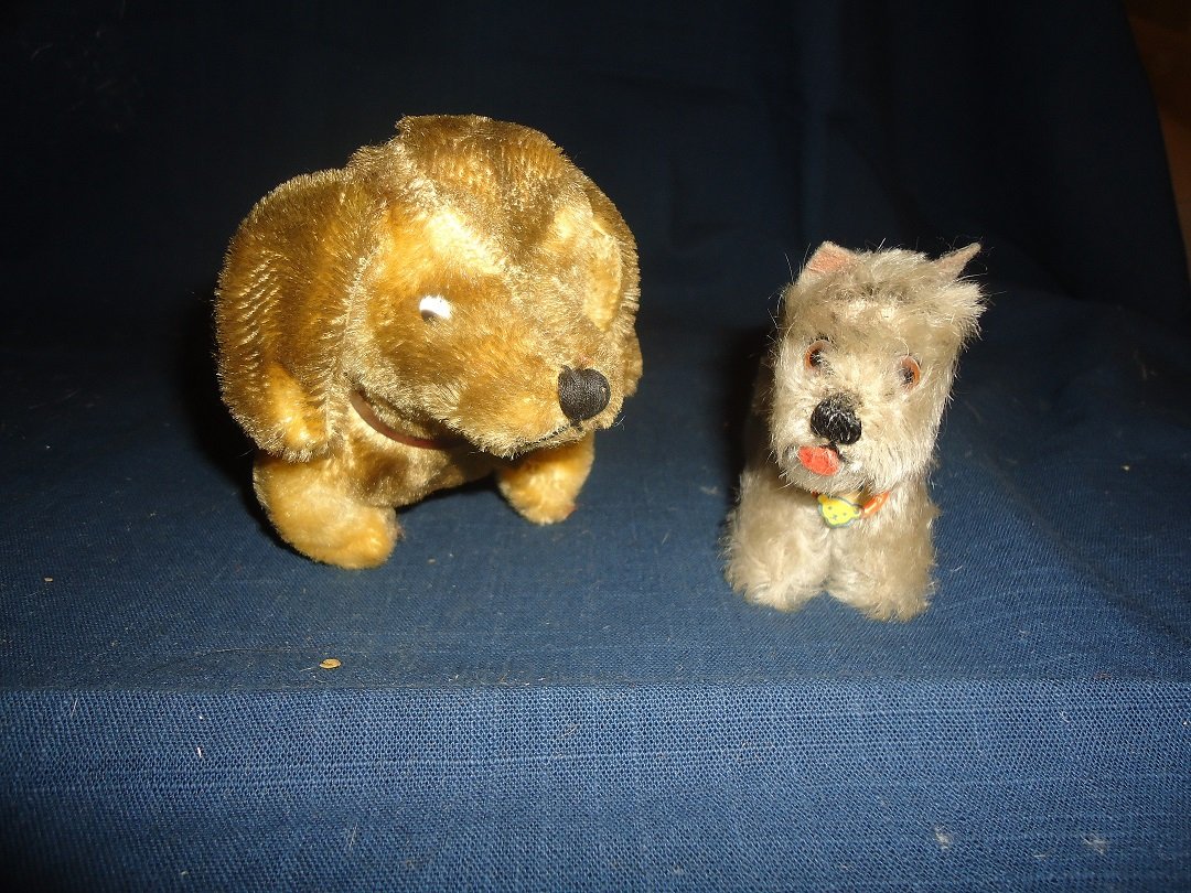 Two Steiff Dogs: Small Schnauzer has tag "Tessie" the larger dog no tag, both sport leatherette collars, larger dog 8" in length.