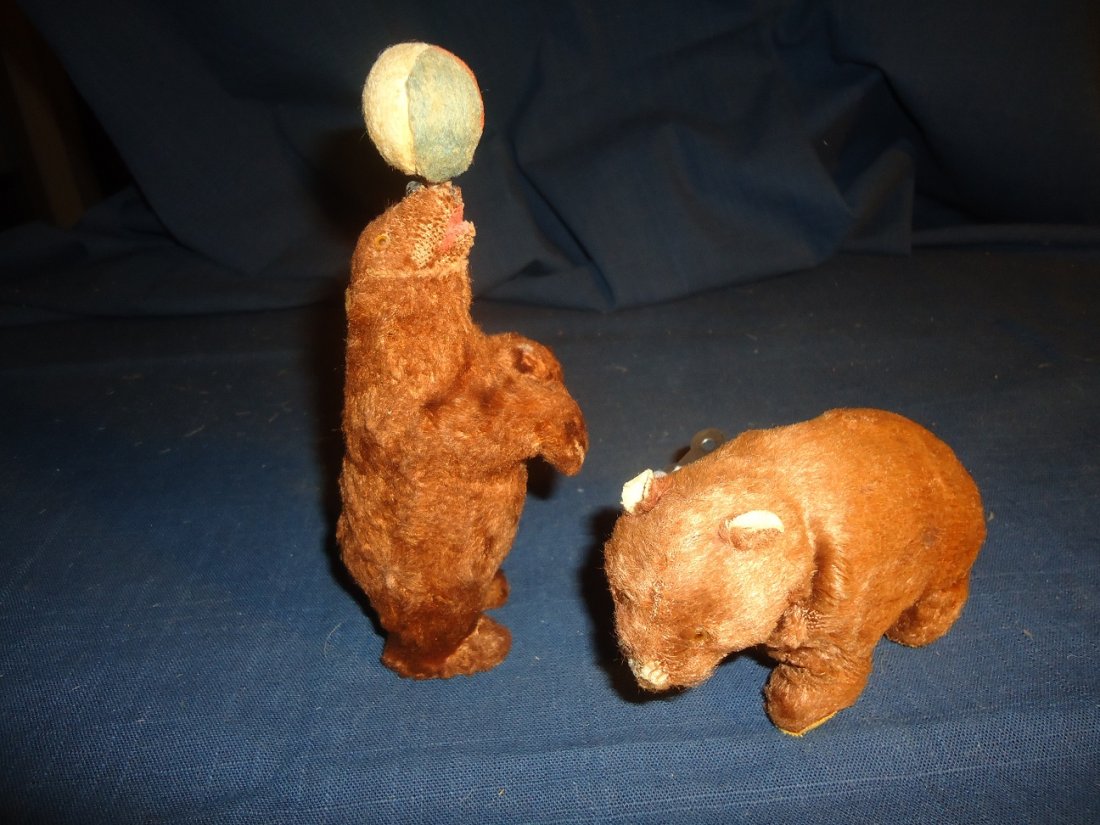 Two Early Wind-Up Bears: Both in working order, bear standing on back legs measures 7" tall no key, both have glass eyes, bear on all fours with key- 5 1/2" in length. Plush good on both.