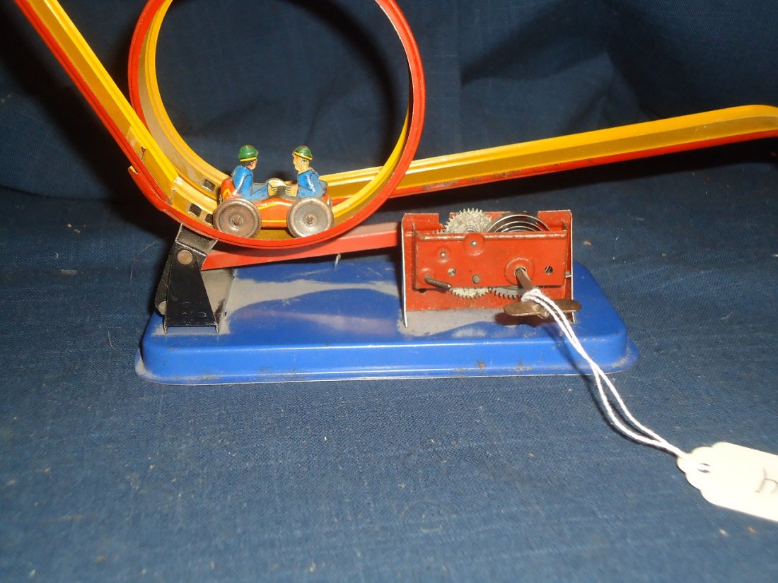 Vintage Wind-Up German Racing Toy: When wound the two man car goes back and forth on a race track. working order, nice surface. 10" length.