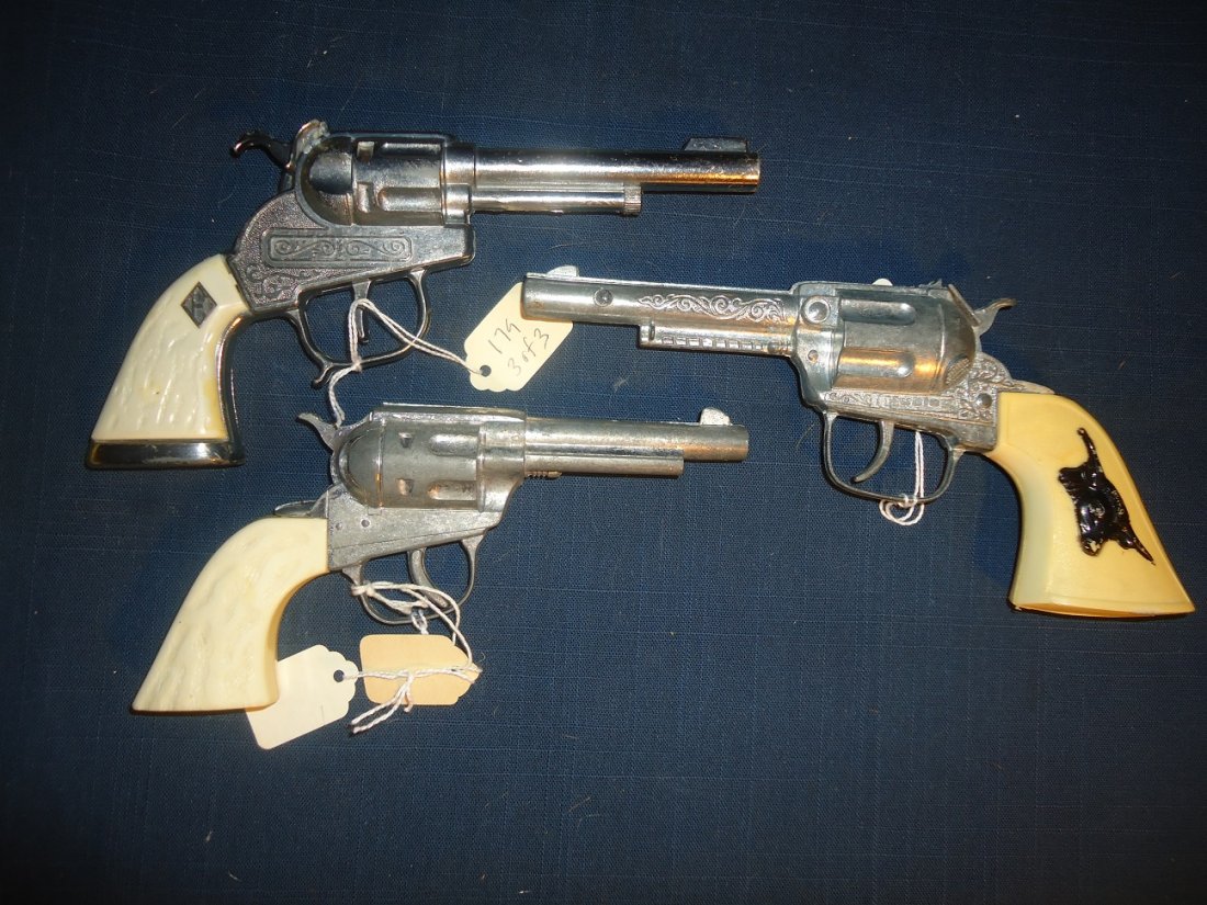 Three Vintage Cap Pistols: Two are Hubley ALL in working order. Largest 8 3/4" length.