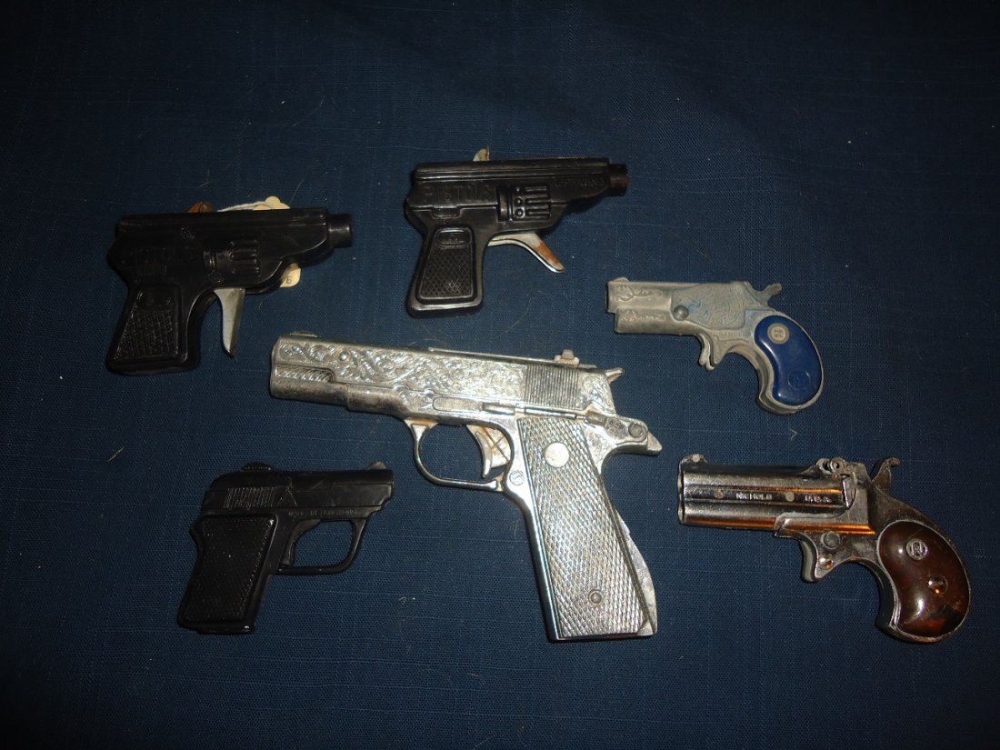 Six Vintage Cap Pistols: Six plastic, three metal, two derringers, Nichols, USA. Other small derringer called "The Gambler"