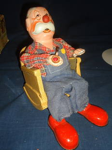 Smoking Grandpa- Battery Operated Toy: Mint in the box, working order.This is what it says on the side of the box:See his pipe light up as he smokeswhen he stops smoking, put two drops of light machine oil in his mouth. He will smoke again