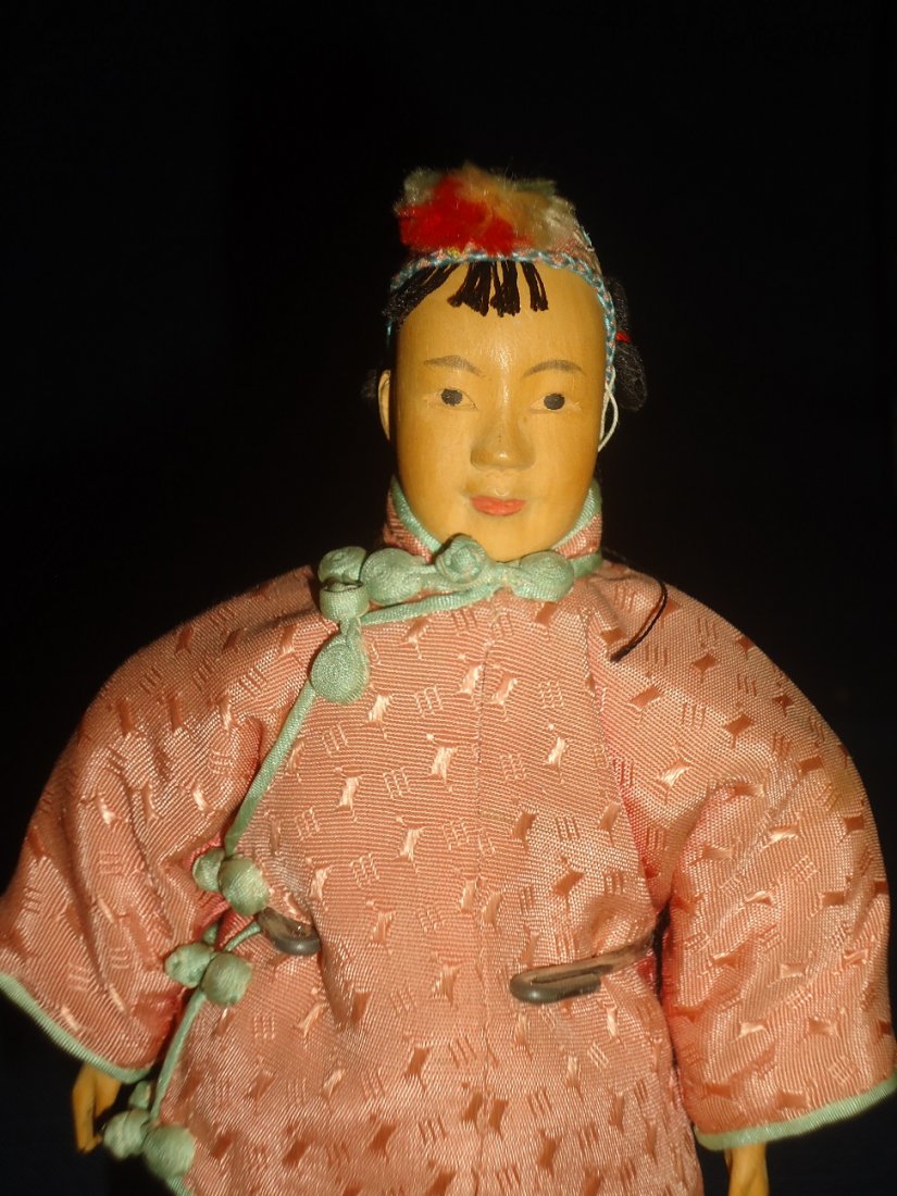 Door of Hope Doll: Beautifully carved and delicate painted features. 7" tall salmon and white outfit, minor fading. Fabric stable.