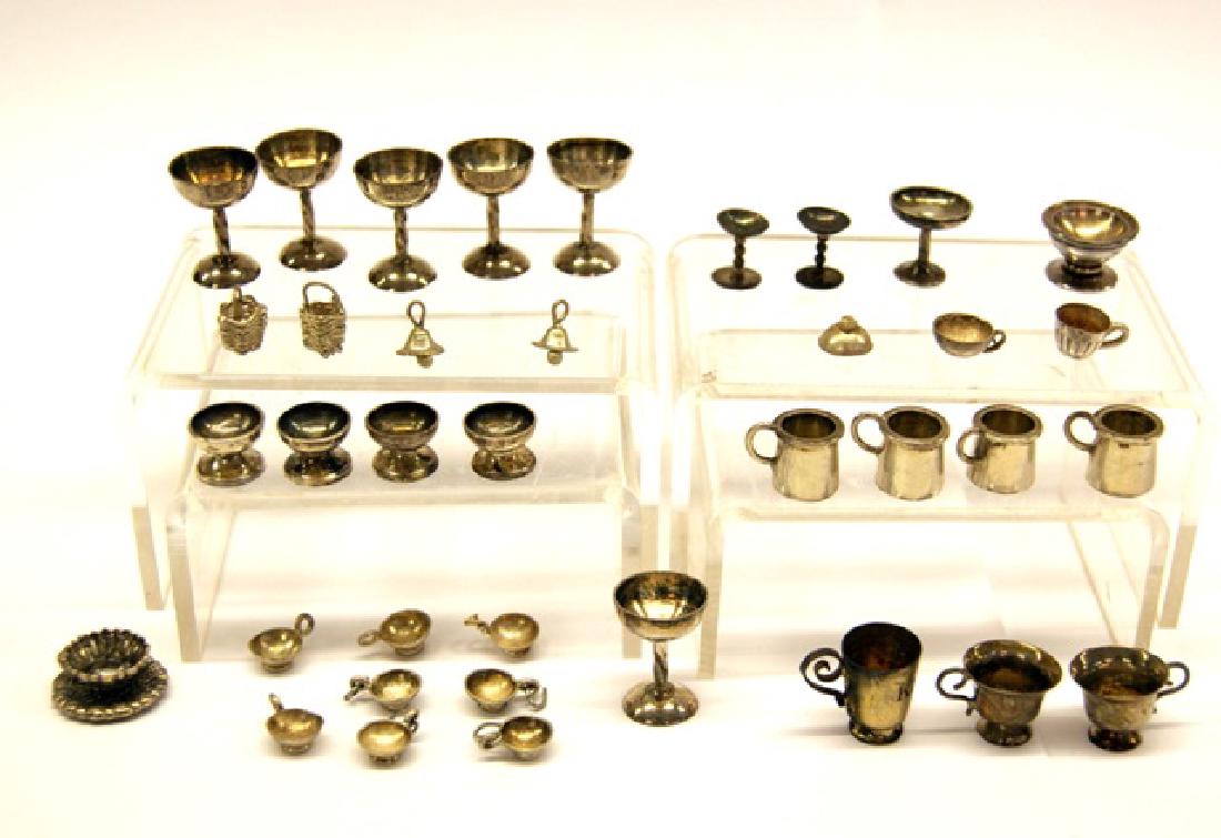 Silver Miniature Cups & Goblets: Six goblets with twist stems .8"H, four mugs with handles .4"H, ten small teacups, set of four sherbets .3"H, compote, pair stem wine glasses .4"H, pair of teacups with scroll handles .4"H, two basket