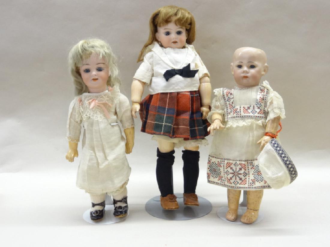 Three Bisque Dolls: K&R 10 in., composition body (as is) chip on head, glass eyes, no wig, S&H 1269, DEP bisque doll, old clothing, composition body, teeth, old wig, blue sleep eyes, nice old shoes, 10 in., A&M 390 glass