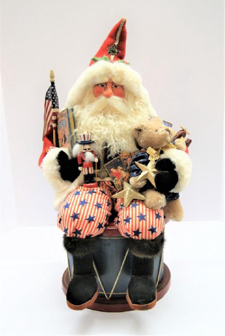 Artist Santa on Drum: Exceptional Wooden carved Santa on Drum, very heavy over 10 lbs., illegible artist signature, he is very patriotic and has pleasant facial features, would be wonderful in your collection. 24"