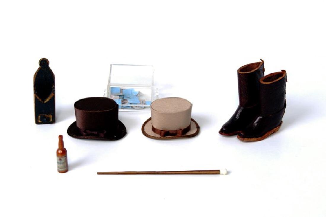 Gentleman's Dollhouse Accessories: L. Hadlock zebra wood with mastodon bone fossil handle dagger cane 2.75"L, pair of top hats, illegibly signed wood pipe box 1.5"H with three clay pipes, pair of leather riding boots, playing cards and