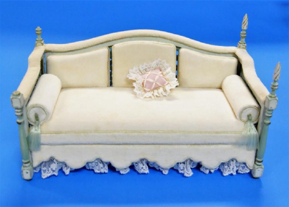 Judy Williamson Garden Sofa for Dollhouse: Judy Williamson sofa with lattice sides and backs, turned corner posts with finials, scalloped skirt with lace trim 6.5"W, 3.75"H, 3.5"D
