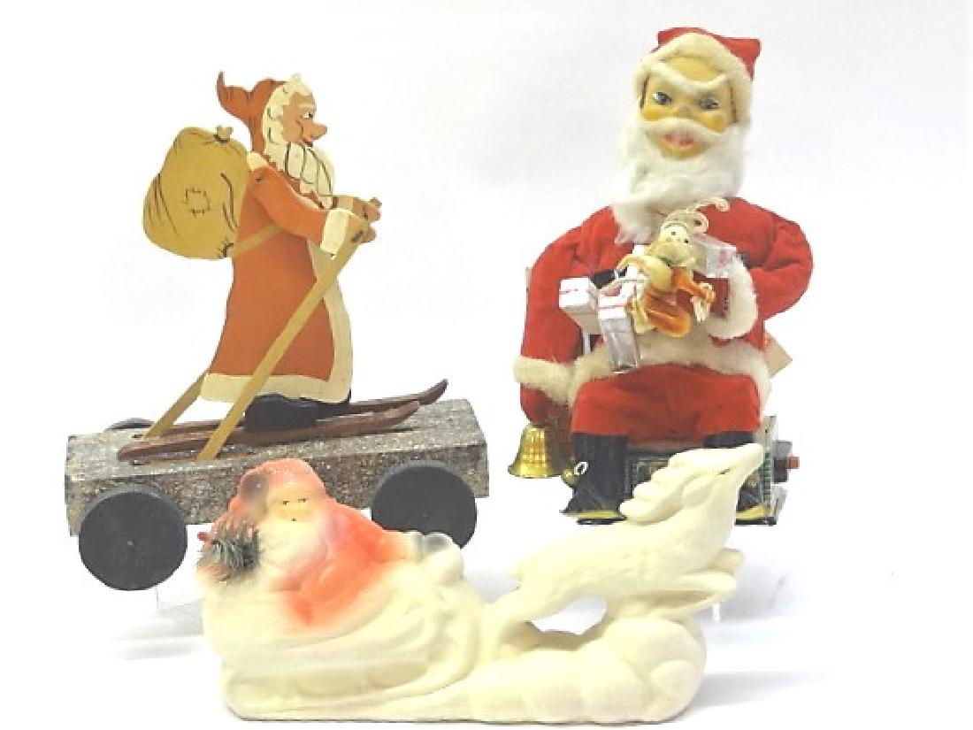 Three Christmas Santas, Wood and Composition: Santa battery operated but not tested, wooden Santa pull toy, contemporary composition Santa and reindeer 11"T