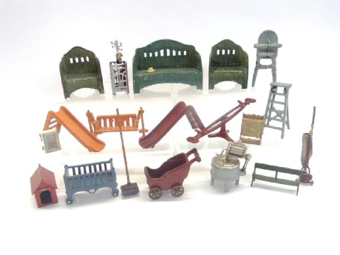 Kenton and Hubley Doll House Furniture: Cast Iron dollhouse furniture, sleds, high chair, washer, see-saw, carriage, crib, ladder, 3" tallest
