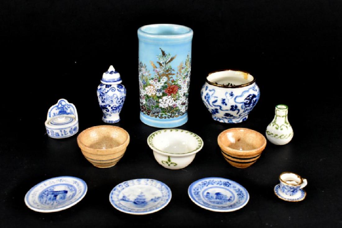 Jean Tag Dollhouse China Miniatures: Jean Tag beautifully decorated umbrella stand 1 7/8"H, blue and white jardinière with gold trim 1.25"W, three blue and white Delft style plates, jar with lid, wine jug, bowl, shaving cup with saucer,