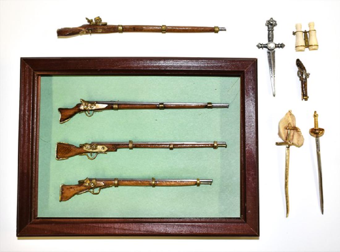 Dollhouse Muskets & Swords Miniatures: Group of three wood and metal muskets 5" to 5.5"L mounted in wood frame, single musket with cracked stock missing trigger guard, swords, pistol and bone Stanhope binocculars