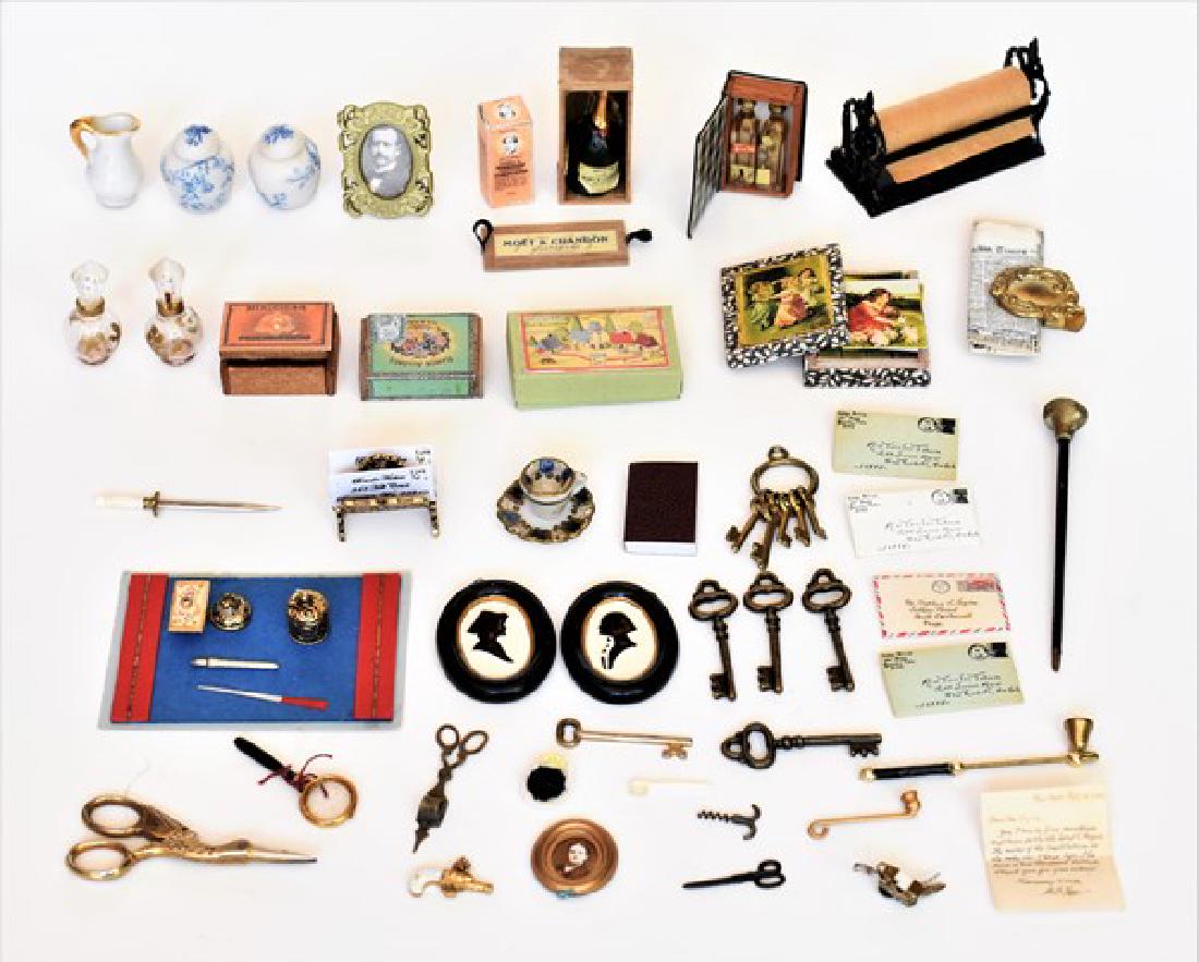 Dollhouse Small Accessories Miniatures: Hollow book with two Scotch bottles inside 1"H, desk mat with letter opener, picture frames, keys, dagger, framed silhouettes, newspaper, boxed bottle of champagne, letters, derringer pistol, scissors